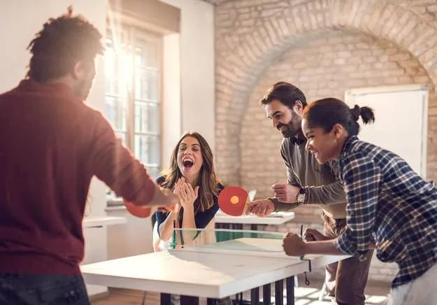 Employees participating in a brief workplace exercise routine
